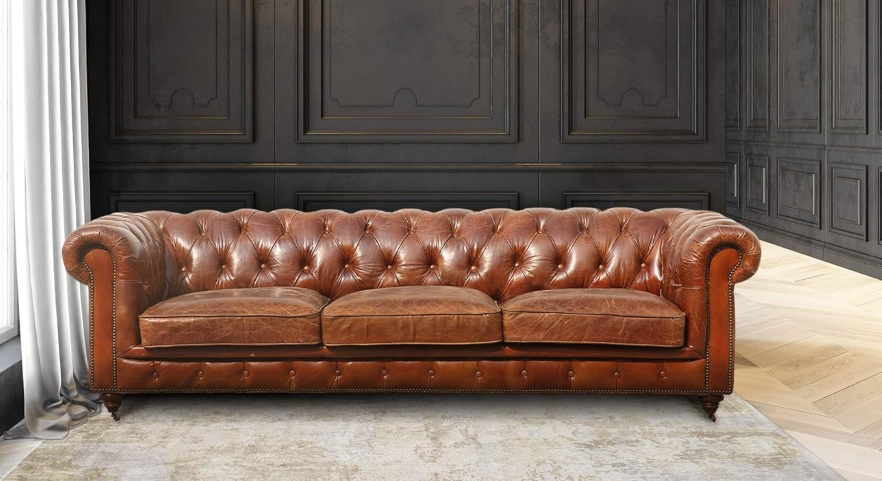 Pasargad Chester genuine leather tufted leather sofa with rolled arms and bun feet in rich brown color.