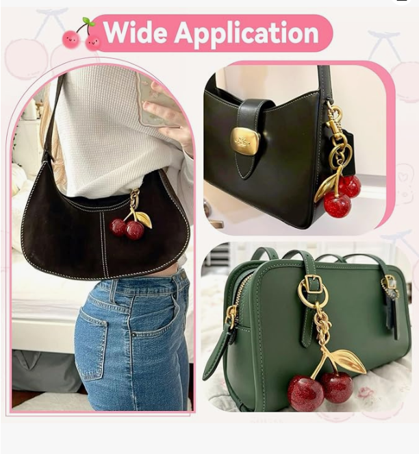 Glitter cherry bag charm clipped onto a tote bag zipper pull