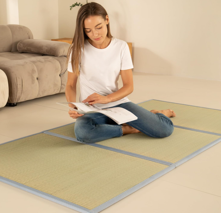 Japanese style tatami room bed frame set up in minimalist zen bedroom with futon mattress